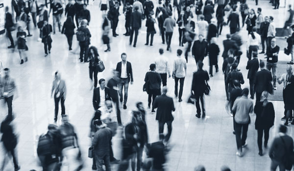 Anonymous Blurred business people walking in a office center